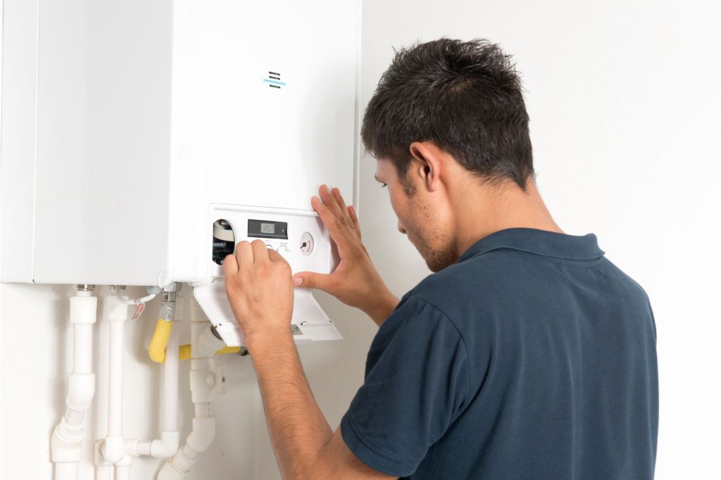 Boiler Installation Linlithgow - here a gas engineer is setting up a new boiler in a Linlithgow kitchen